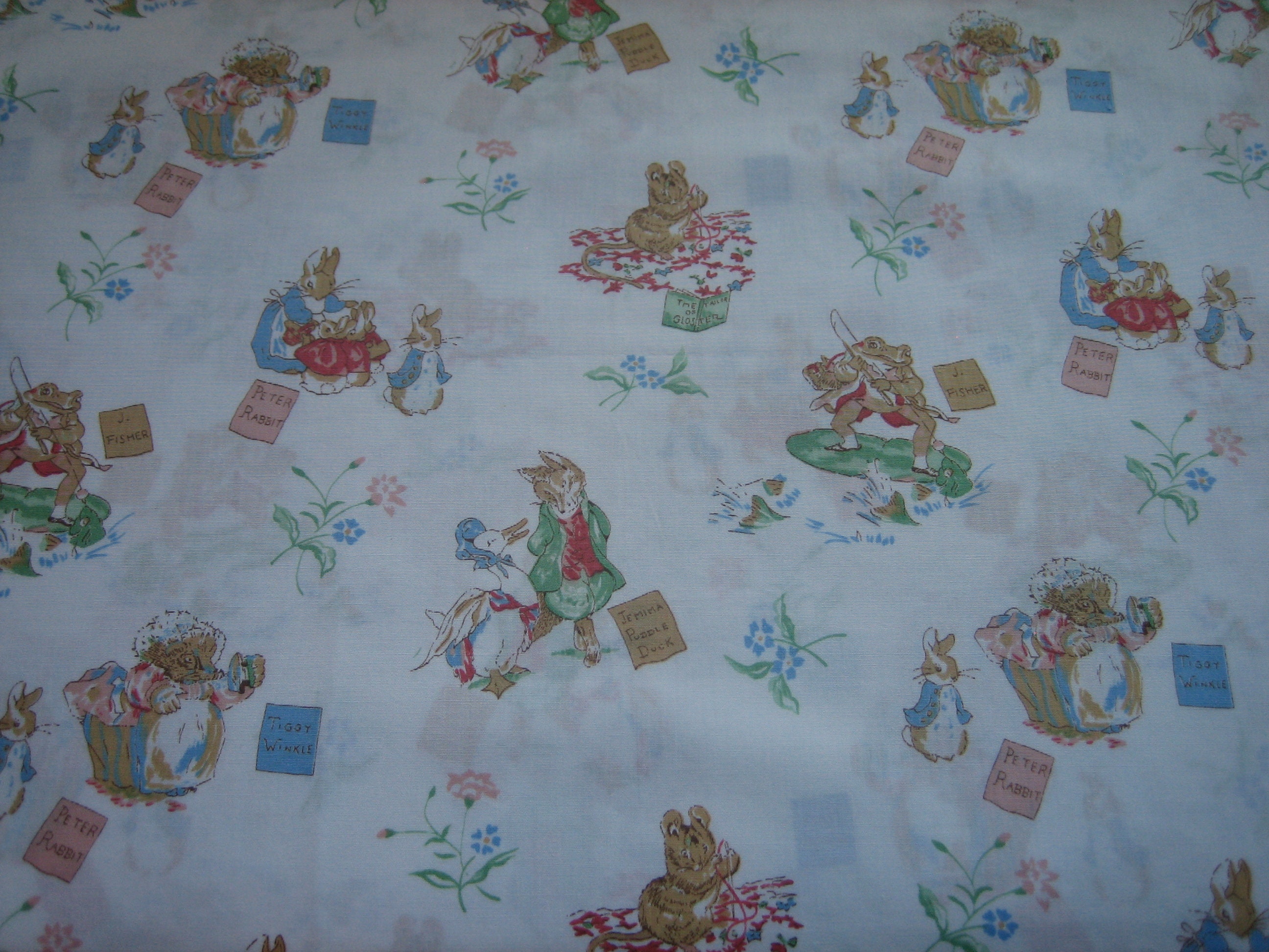 Beatrix Potter characters on white Spring Industries, slight sheen ( 18 x 44  inches ), 1986