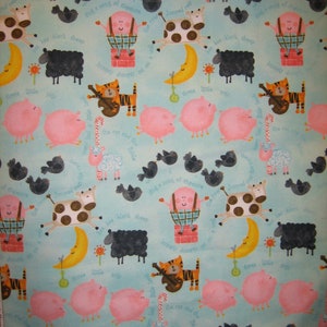 May include: A blue and white fabric with a repeating pattern of animals and text. The text includes "jumped over the moon", "three little pigs", "the cat sat on the mat", and "it's a sack of potatoes".