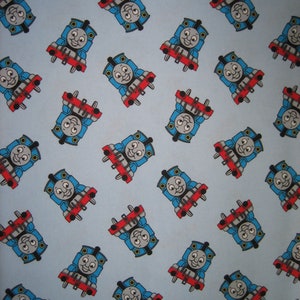 Thomas the Tank Engine on sky blue FLANNEL fabric  ( 36 x 42 inches )