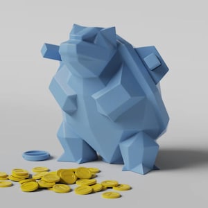 May include: A light blue geometric bear-shaped piggy bank with a small blue coin slot and a pile of yellow coins. The bear has a faceted design and stands on a white surface.