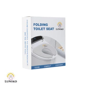May include: A white product box for a folding toilet seat by Luniko. The box features the text FOLDING TOILET SEAT, FROM DIAPERS TO INDEPENDENCE, WE'RE WITH YOU, CLEAN, COMPACT, CONFIDENT, and a graphic of a gray toilet seat with a bear logo.