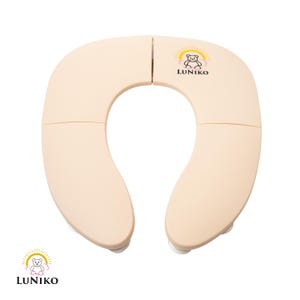 May include: A beige, U-shaped foldable toilet seat cover with a smooth finish. The top right section features a logo with a bear illustration, a yellow sunburst, and the text LUNIKO. The same logo appears in the bottom left corner of the image.
