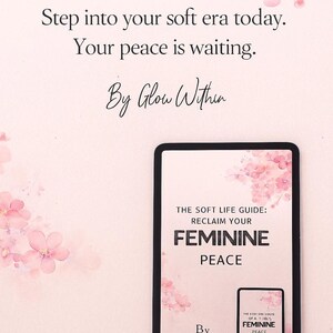 Op de afbeelding: Een digitale tablet toont een boekomslag met de titel "The Soft Life Guide: Reclaim Your Feminine Peace". De achtergrond is zachtroze met bloemaccenten en de tekst "Step into your soft era today. Your peace is waiting."