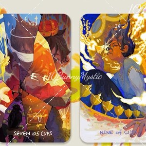 May include: Two tarot cards with colorful illustrations. The left card reads "SEVEN OF CUPS" and depicts a figure with a crown. The right card reads "NINE OF CUPS" and shows a person with a cup. The artist's name, "10BunnyMystic", is visible.