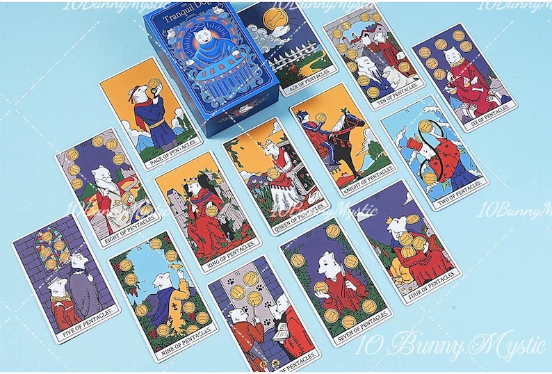 May include: A deck of tarot cards titled The Tranquil Dog, featuring illustrations of white dogs in various scenes. The cards include the Ace, Two, Four, Five, Six, Seven, Eight, Nine, Ten of Pentacles, plus the Page, Knight, Queen, and King of Pentacles.