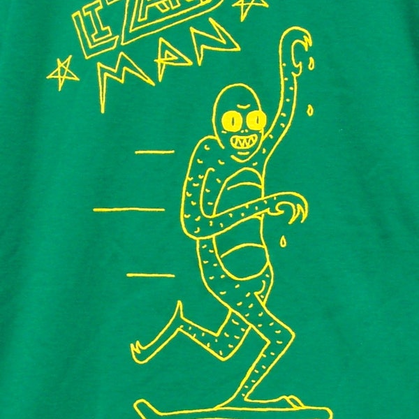 Skateboarding Lizard Man T-shirt by Andy Finkle