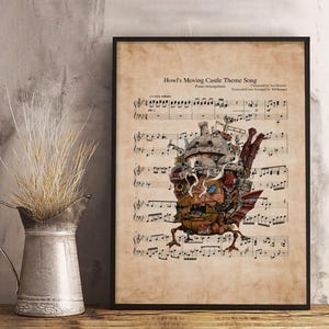 May include: A framed print of sheet music featuring the "Howl's Moving Castle Theme Song." The artwork includes a detailed illustration of the moving castle, with musical notes and text in a vintage style. The print is in a black frame.