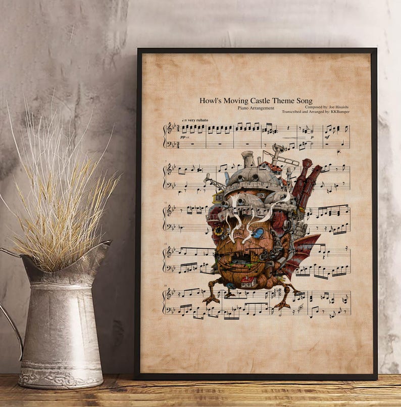 May include: A framed print of sheet music featuring the "Howl's Moving Castle Theme Song." The artwork includes a detailed illustration of the moving castle, with musical notes and text in a vintage style. The print is in a black frame.