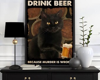 May include: Black framed poster with a black cat holding a beer. The poster has the text "DRINK BEER BECAUSE MURDER IS WRONG" in white letters. The background features brown barrels.