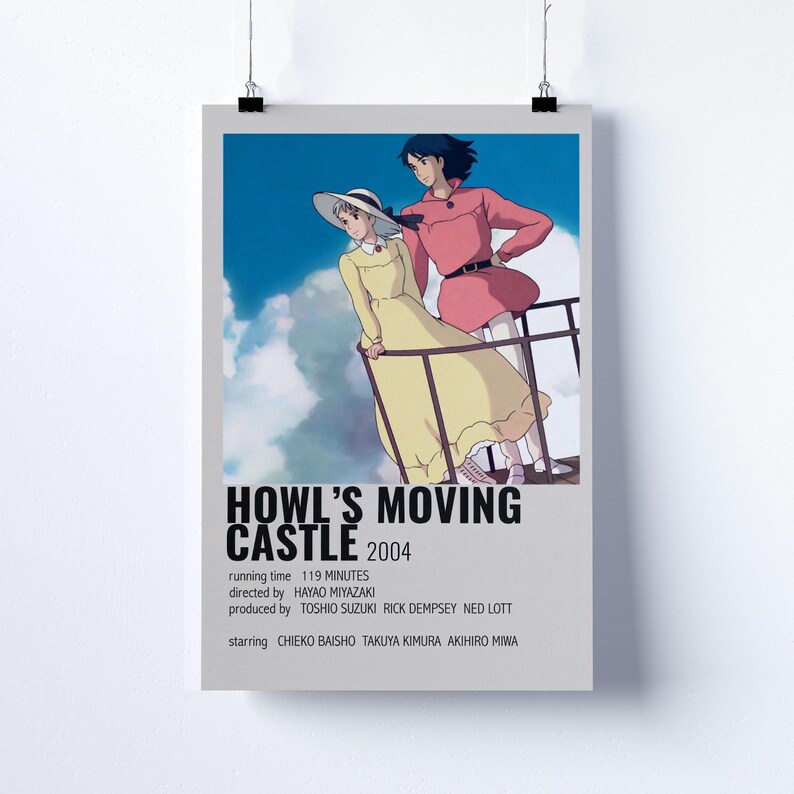 May include: Poster for the animated film "Howl's Moving Castle" with two characters in the foreground. The poster includes the film's title, year, and credits. The background is a blue sky with clouds.