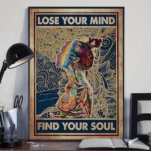 May include: A framed poster with the text "LOSE YOUR MIND FIND YOUR SOUL". The artwork features a colorful illustration of a person's silhouette with a floral design and a blue background.