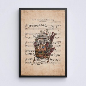 May include: Framed print of sheet music for "Howl's Moving Castle Theme Song." The artwork features a detailed illustration of the moving castle from the film, superimposed over the musical notes. The print is in a black frame.