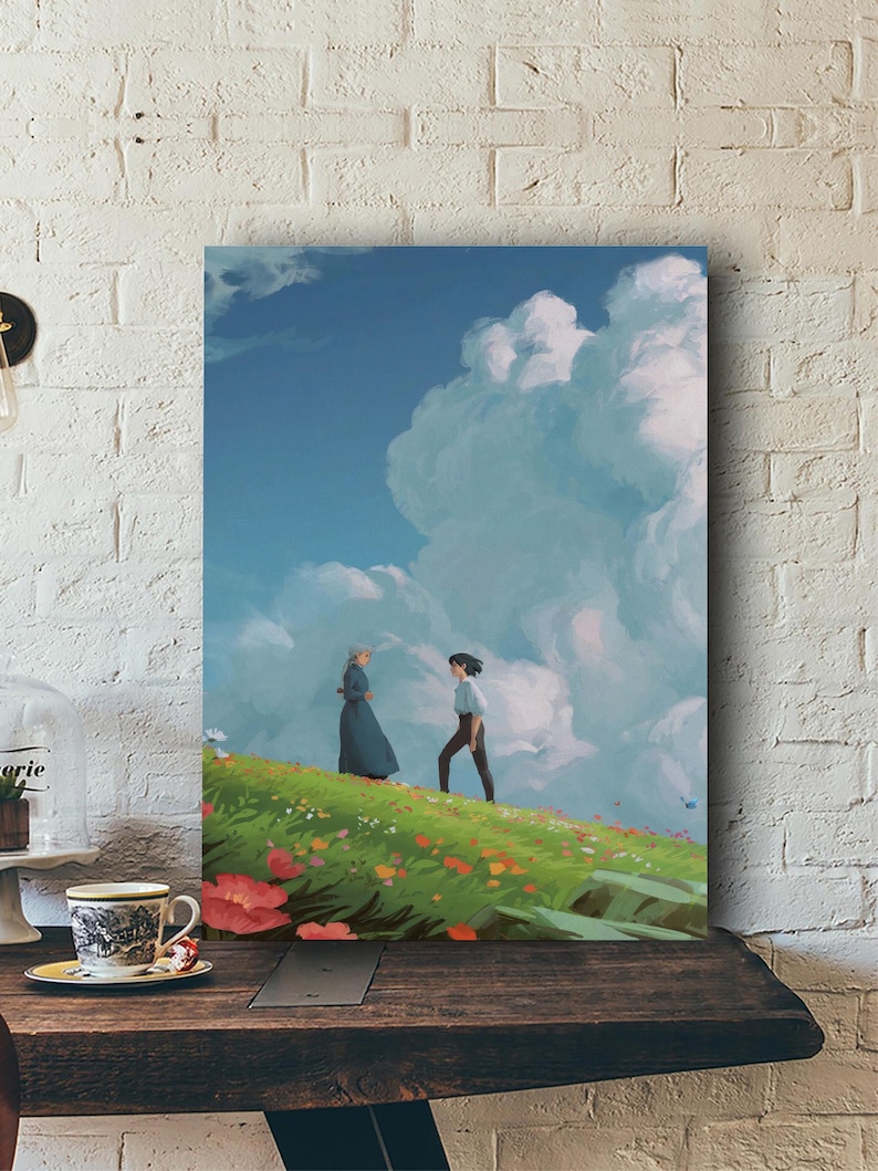 May include: A canvas print depicts two figures on a grassy hill under a blue sky with large, fluffy clouds. One figure wears a long blue dress, the other a light blue shirt and dark pants. The scene is filled with colorful flowers.