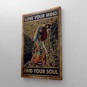 May include: A framed canvas art print featuring a colorful illustration of a person's profile with a rainbow-colored head and body art. The text "LOSE YOUR MIND" and "FIND YOUR SOUL" are displayed in bold, black letters.