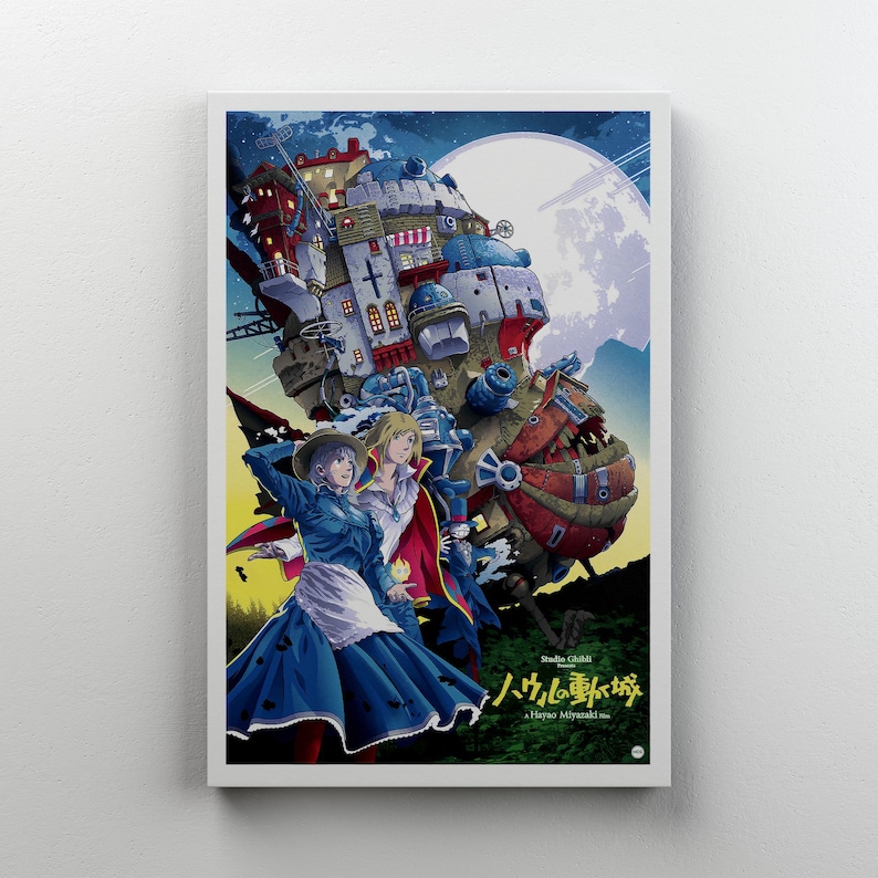 May include: A framed poster with an anime-style illustration. The artwork shows a large, fantastical moving castle with characters in the foreground. The colour palette includes blues, reds, and yellows, with a full moon in the background. Japanese text is visible.