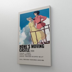 May include: A framed poster featuring artwork from the animated film "Howl's Moving Castle" from 2004. The poster shows two characters on a balcony with text at the bottom. The poster is on a white background.