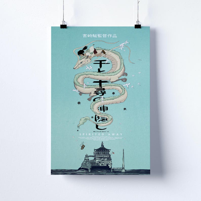 May include: A poster with a light blue background, featuring a white dragon with a person riding it. Japanese text is present, along with the English title "Spirited Away". The poster depicts a scene from the animated film.