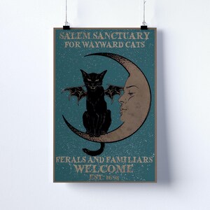 May include: A teal poster featuring a black cat with bat wings on a crescent moon. The poster's text reads "Salem Sanctuary for Wayward Cats" and "Ferals and Familiars Welcome", with "Est. 1692" at the bottom. The cat has red eyes.