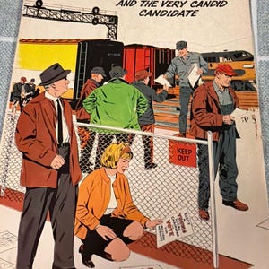 May include: Comic book cover titled "Cliff Merritt and the Very Candid Candidate." The artwork depicts a political scene with figures in coats and hats, a train, and signs that say "Keep Out" and "Vote for William Merritt."