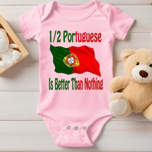 May include: Pink baby onesie with the text "1/2 Portuguese Is Better Than Nothing" and a graphic of the Portuguese flag.