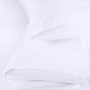 A close-up view of a white pillowcase or duvet cover, with a smooth and soft texture.