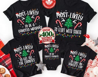 May include: Five black t-shirts and a baby bodysuit featuring Christmas graphics including a green tree, candy canes, reindeer, and text such as Most Likely To Be A Gangsta Wrapper, Flirt With Santa, Eat All The Cookies, Santa's Favourite, and Fart On Santa's Lap.
