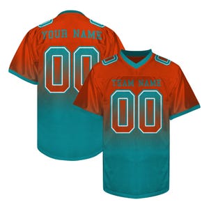 May include: Orange and teal football jersey with the number "00" on the front and back. The jersey has a gradient design, transitioning from orange at the top to teal at the bottom. The text "YOUR NAME" and "TEAM NAME" are visible.