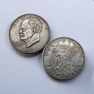 Moneda de un dólar estadounidense de colección, chapada en plata, de 1971-1978, con la efigie de D. Eisenhower: importancia histórica.