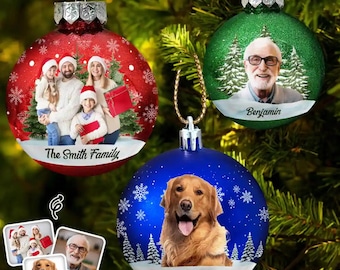 May include: Three round Christmas ornaments featuring custom photo prints. The red ornament shows a family of four with the text The Smith Family. The green ornament displays a man with glasses and the name Benjamin. The blue one shows a golden retriever and the name Bailey.