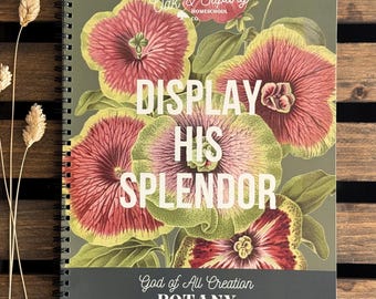 May include: A spiral-bound notebook with a dark olive green cover featuring a botanical illustration of large pink and yellow flowers. The text reads "Oak & Sapling Homeschool Co.", "DISPLAY HIS SPLENDOR", "God of All Creation", and "BOTANY" in white.