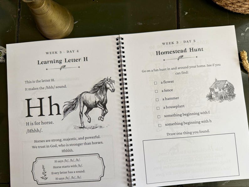 May include: A spiral-bound educational workbook open to two pages. The left page features the letter H, a horse illustration, and text including 'Learning Letter H' and 'H is for horse.' The right page is titled 'Homestead Hunt' with a checklist.