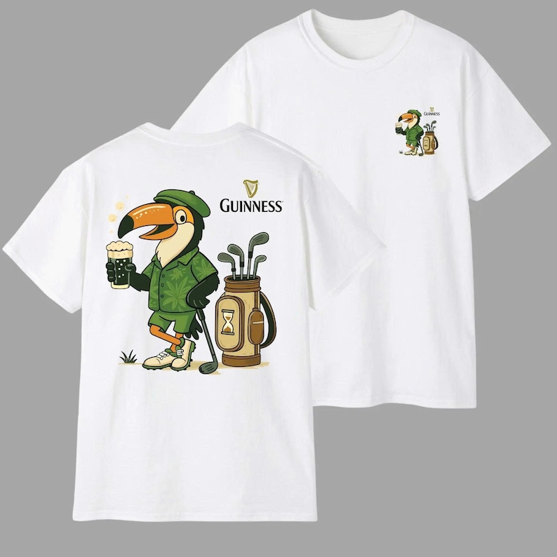 May include: White t-shirts featuring a cartoon toucan wearing a green golf outfit and holding a pint of beer. The Guinness logo is above the toucan on the back of the shirt. A smaller version of the toucan is on the front of the shirt.