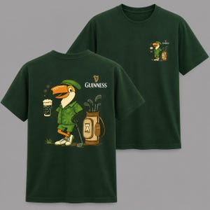 May include: Dark green t-shirts with a cartoon toucan wearing a golf outfit and holding a pint of beer. The toucan is next to a golf bag with clubs. The Guinness logo is above the toucan. A smaller version of the toucan is on the back of the shirt.