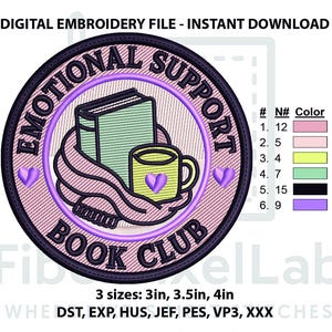 May include: A circular digital embroidery design featuring a light pink background with a dark purple border. The text reads EMOTIONAL SUPPORT BOOK CLUB. It depicts a light green book, a yellow mug, and a pink scarf, with purple heart accents.