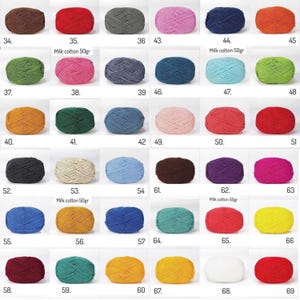 May include: A collection of colorful yarn balls in various shades, including brown, red, green, blue, pink, and yellow. Each ball is labeled with a number and some have the text "Milk cotton 50gr". Ideal for knitting and crochet projects.