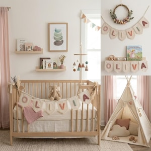 May include: A nursery with a wooden crib, a teepee, and shelves. The crib has a banner that spells "OLIVIA". The room is decorated in soft pinks, creams, and natural wood tones. A mobile hangs above the crib, and a framed print is on the wall.