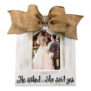 Distressed White He asked…She said yes Frame with Burlap Jeweled Bow available in 4x6, 5x7 or 8x10