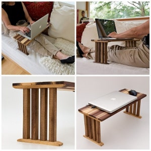 May include: A wooden laptop stand with a natural wood finish. The stand has a rectangular top and four legs. The stand is shown in three different positions: on a couch, on a bed, and on a table. The stand is perfect for working on a laptop while sitting on a couch or bed.