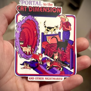 May include: A rectangular sticker with a white border featuring a cartoon scene. The text "PORTAL to the CAT DIMENSION" is at the top, and "AND OTHER NIGHTMARES!" at the bottom. The scene depicts cats, a portal, and a person.