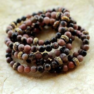 Beaded Stretch Bracelet with Rhodonite Pink Black Beads and Gold Pave Embellishments