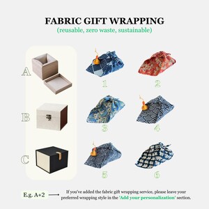 May include: Image showcasing fabric gift wrapping options. Includes various patterned fabric wraps and three different box styles. Text reads "FABRIC GIFT WRAPPING (reusable, zero waste, sustainable)". Instructions are provided for personalization.
