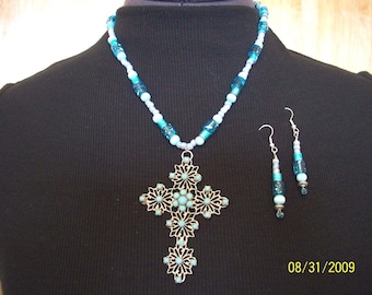 18 inch cross necklace with turqouise blue beads and matching earrings.