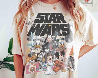 Maglietta di Topolino e i suoi amici di Star Wars, maglietta Disney di Topolino e Han Solo, magliette di Goofy Stormtrooper, maglietta di Paperino Jedi, magliette di Galaxy's Edge