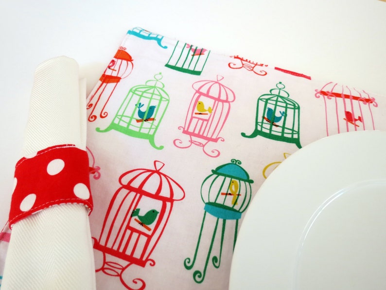 Pair of Reversible Placemats and Napkin Rings: Colorful Birdcages with Red Polka Dots image 1