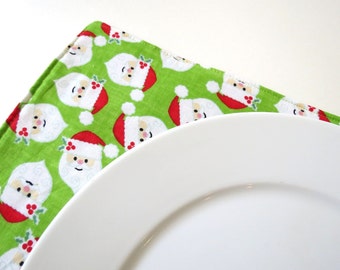 Pair of Reversible Placemats: Christmas Plaid and Santa Clauses