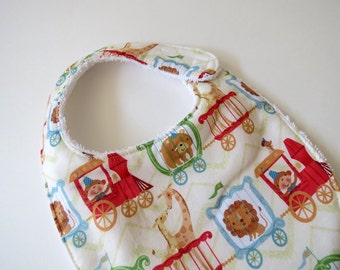 Baby Circus Train on Ivory Chevron reversible baby bib with white terry cloth