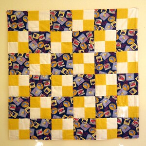 Dolphin Cove Little Sailor baby quilt in nautical navy, yellow, white and red image 2