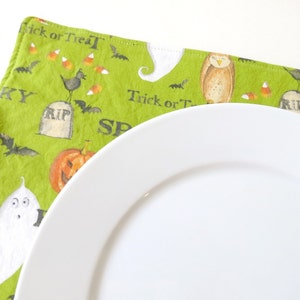 Pair of Reversible Placemats: Spooky Halloween Green with Black Polka Dots image 1