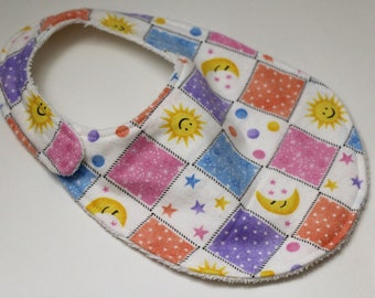 Sun, Moon, & Stars Squares flannel reversible baby bib with White terry cloth