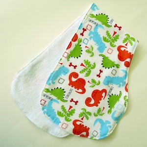 Contoured Burp Rag: Colorful Dinosaurs with White Terrycloth